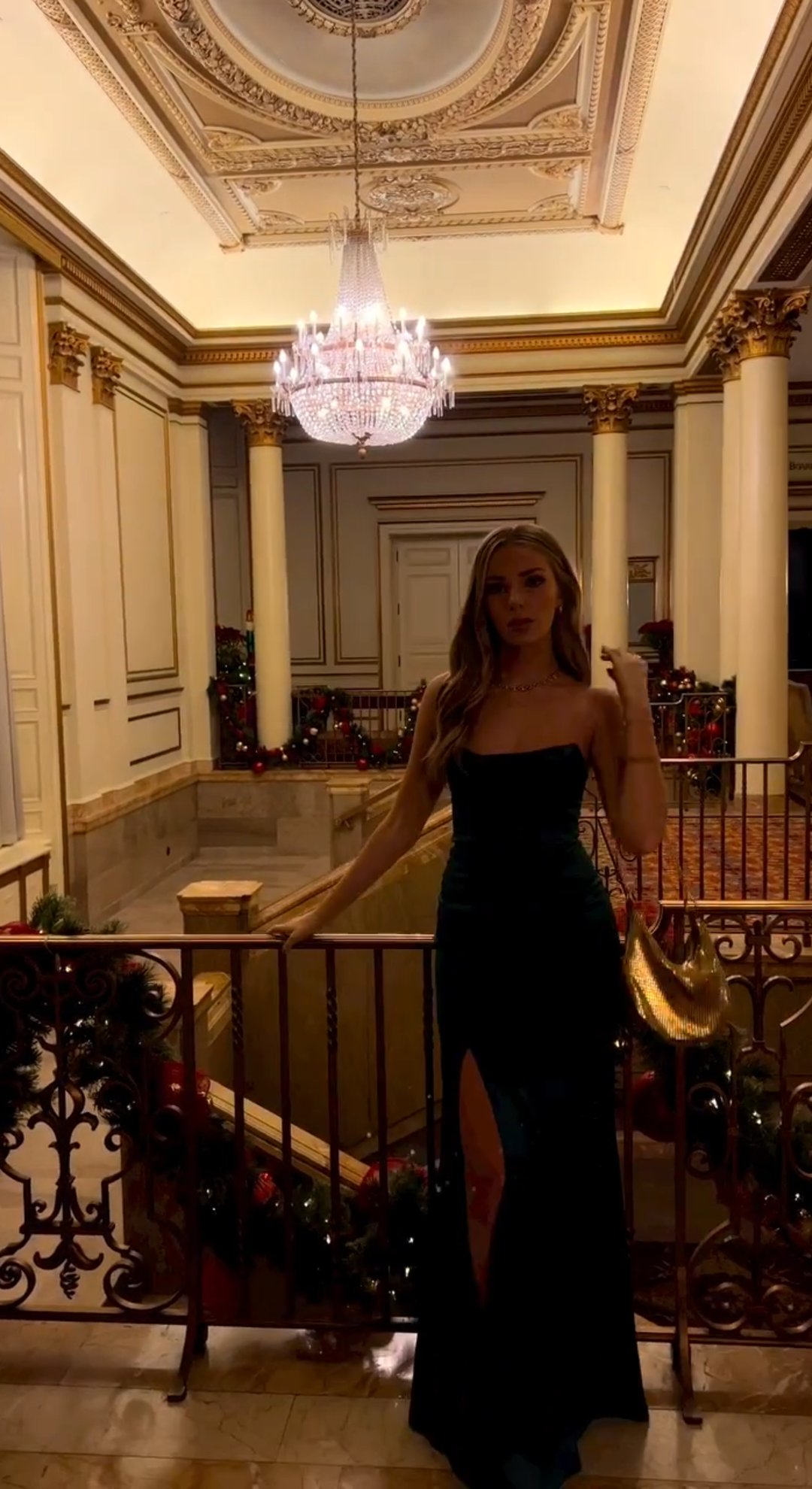 Deep green dress beneath crystal lights on Christmas Eve