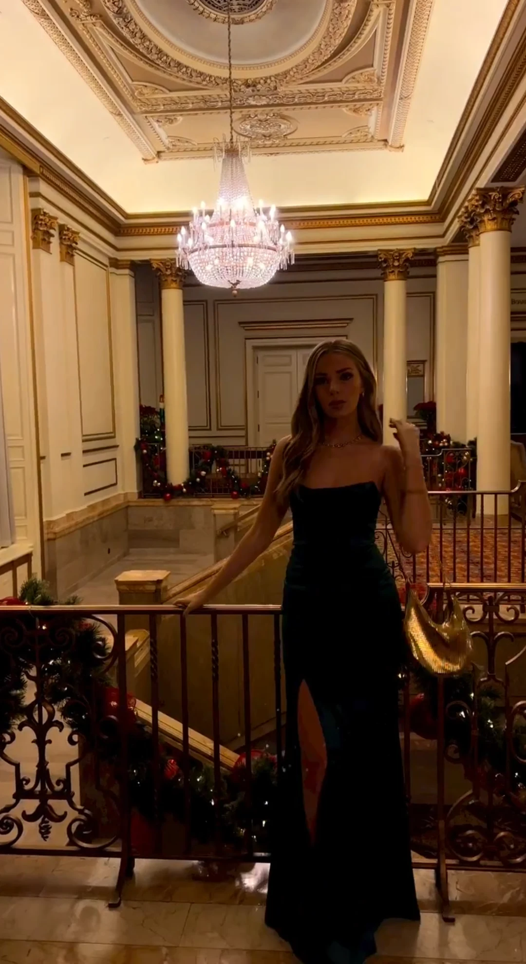 Deep green dress beneath crystal lights on Christmas Eve